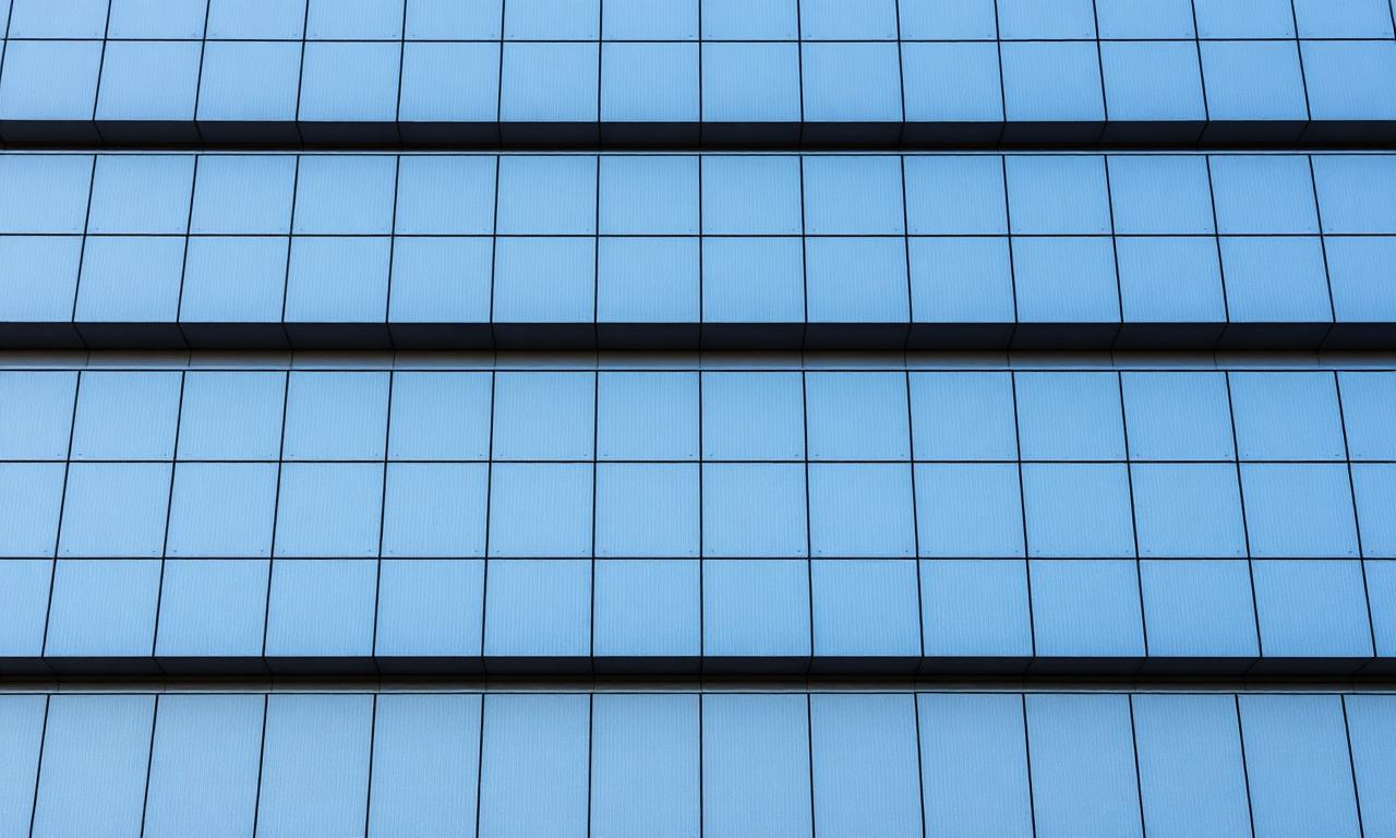 Parallel lines of a modern building facade representing payroll systems